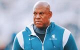 Michigan State football coach faces hearing over harassment allegations