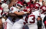 Basketball powerhouses make history in college football rankings