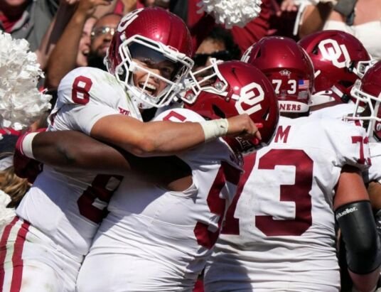 Basketball powerhouses make history in college football rankings