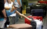Airline passengers with luggage at the airport