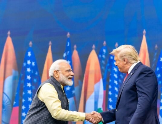 Trump Modi handshake meeting