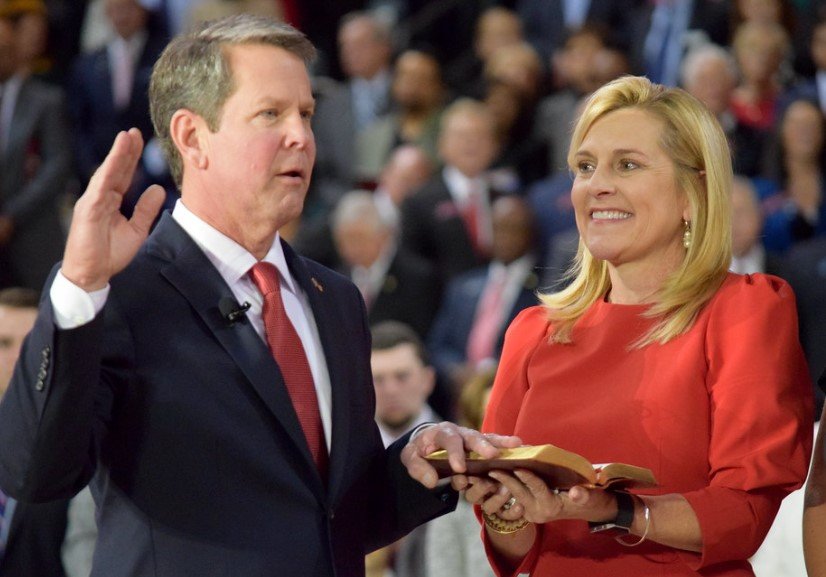Georgia Governor Brian Kemp signing school
