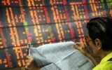 Traders panic on Tokyo Stock Exchange as global markets