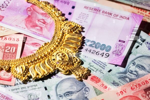 Indian rupee currency notes and gold