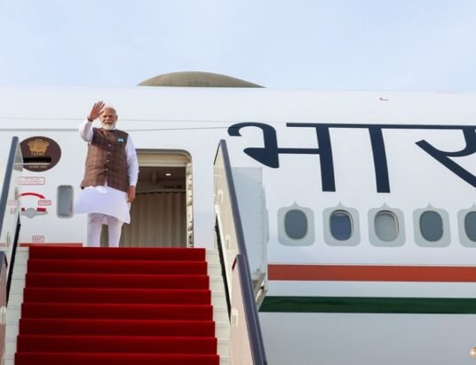 Narendra Modi boarding aircraft