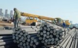workers loading steel products at Chinese