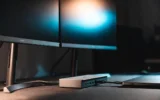 Belkin 14-in-1 Thunderbolt 5 dock on a desk with triple monitors