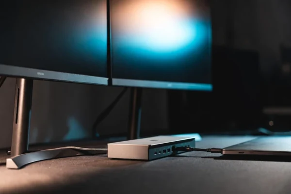 Belkin 14-in-1 Thunderbolt 5 dock on a desk with triple monitors