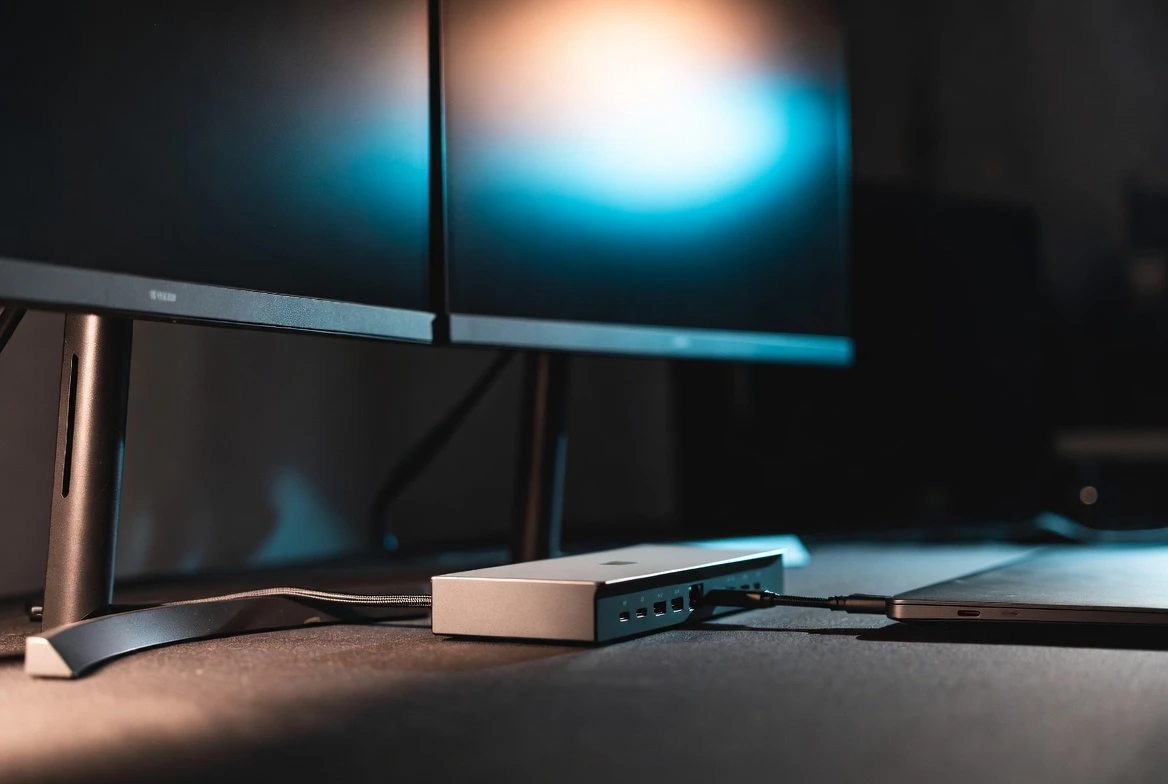 Belkin 14-in-1 Thunderbolt 5 dock on a desk with triple monitors