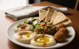 Mediterranean Grill Athens vegetarian plate with falafel hummus and baba ghanouj.