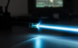 Hawking radiation backreaction optical fiber black hole analog experiment