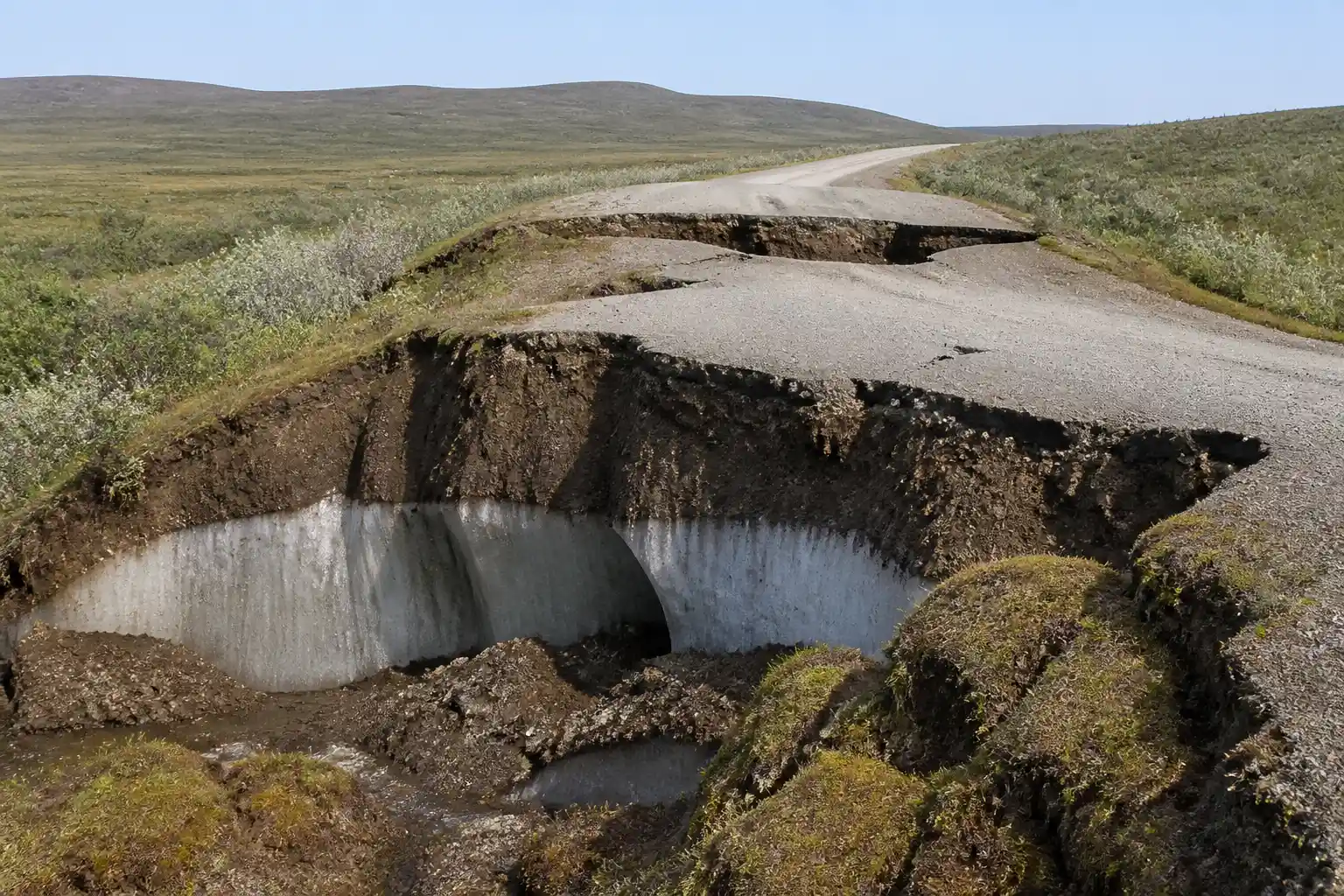 Alaska permafrost thaw sinking road and tundra carbon release